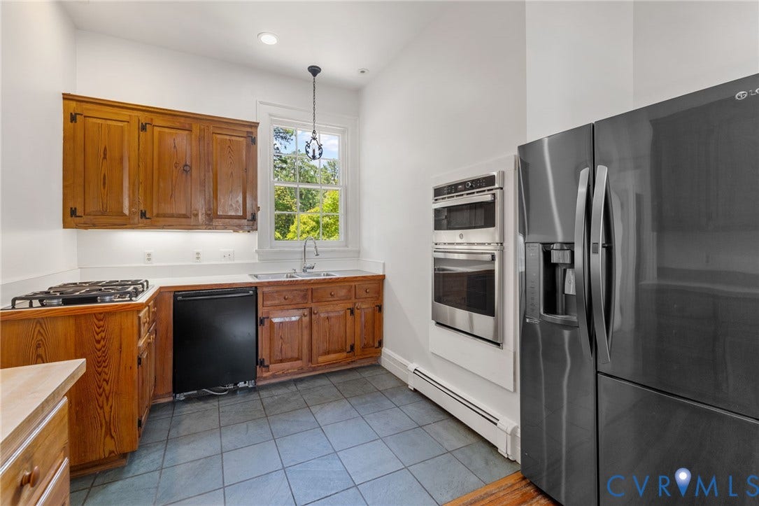 Kitchen featuring wood cabinetry, integrated gas cooktop, stainless steel double wall oven, and a French door refrigerator