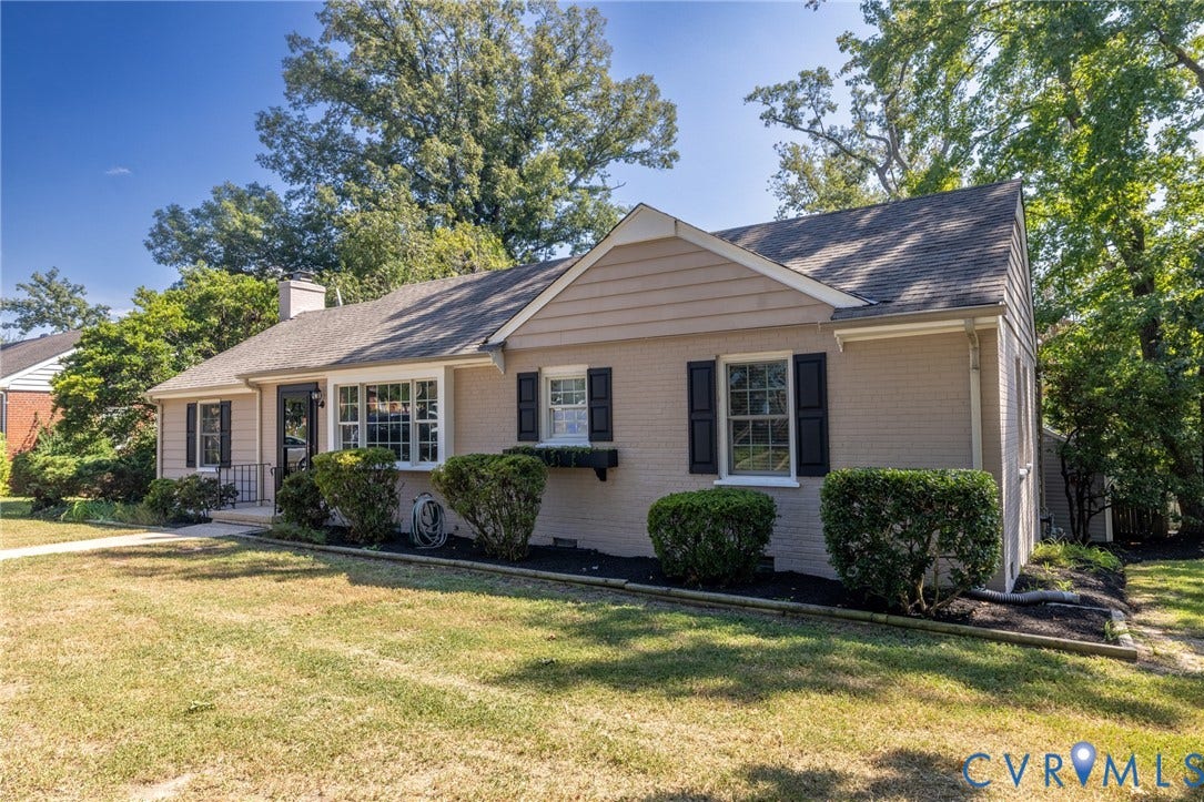8415 Holly Hill Road, Henrico, VA 23229 Traditional-style exterior with a gabled roof and brick facade