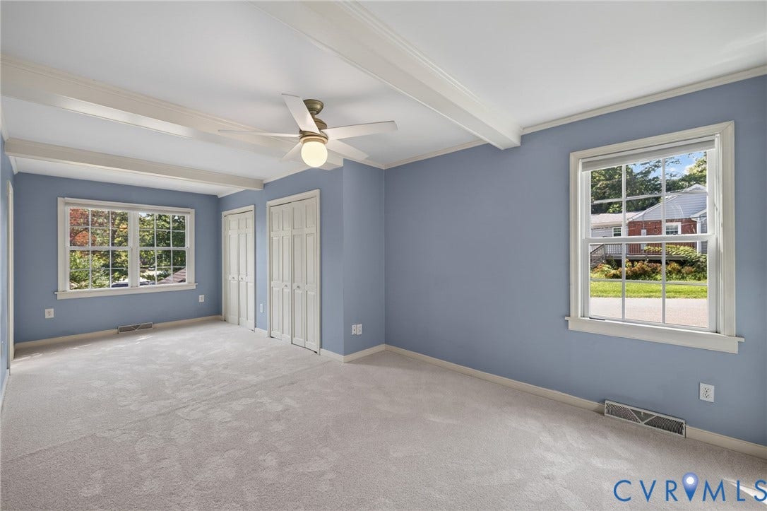 8415 Holly Hill Road, Henrico, VA 23229 Exposed ceiling beams, dual windows, ceiling fan, and light gray carpeted flooring