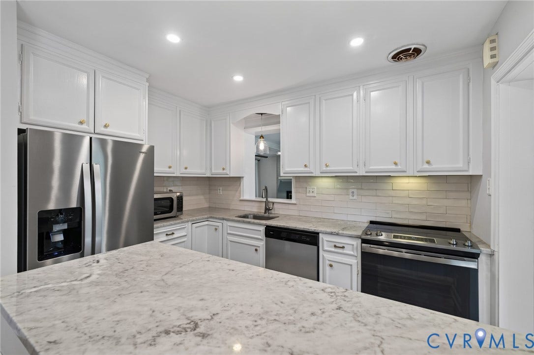8415 Holly Hill Road, Henrico, VA 23229 Kitchen featuring white cabinetry with gold-toned hardware, light-toned countertops, a stainless steel side-by-side refrigerator, a stainless steel dishwasher, and an electric range