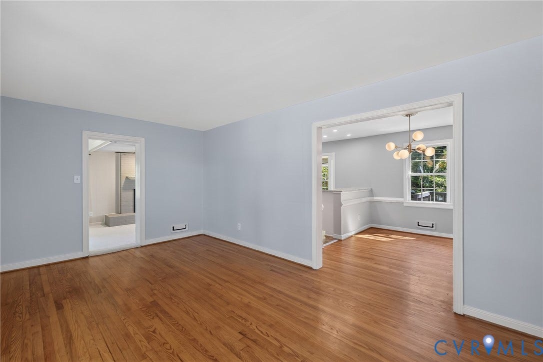8415 Holly Hill Road, Henrico, VA 23229 Hardwood flooring, light blue wall paint, and white trim