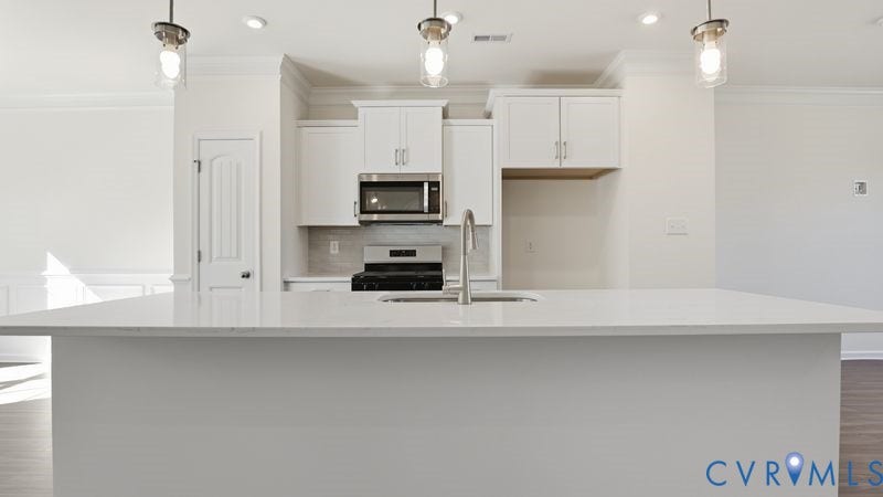 2417 Flora Boulevard, Townes At Arcadia, Henrico, VA 23231 This photo shows a similar floorplan and quality level to Eastwood Homes. Actual design selections and layout may vary.