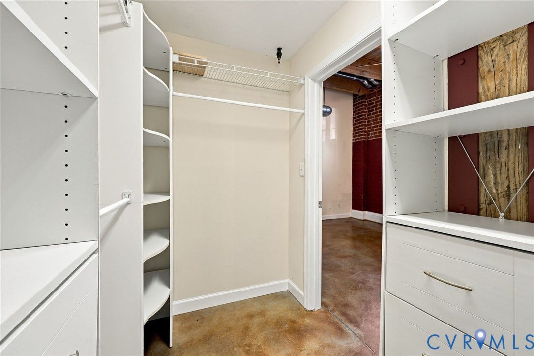 815 Porter Street, #U106, Manchester, Richmond, VA 23224 Custom closet system featuring white shelving and integrated drawers