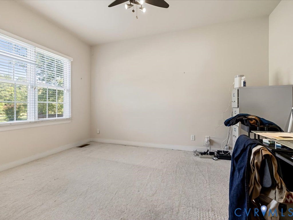 first floor bedroom with full bath off kitchen