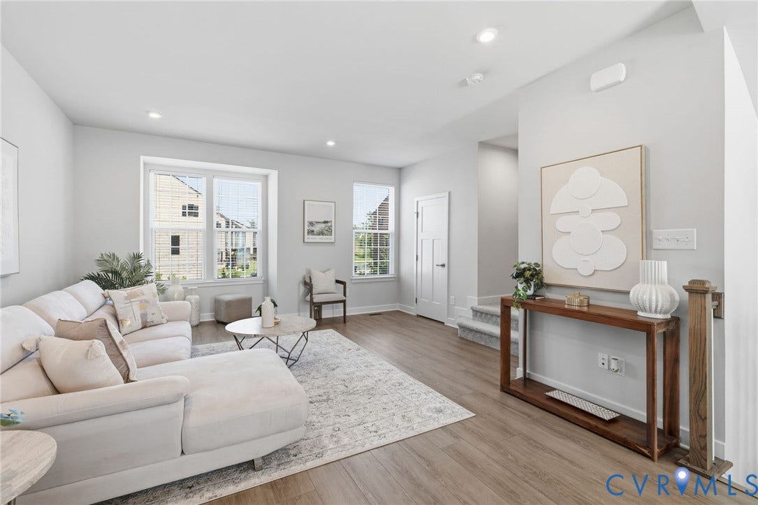 Recessed lighting, wood-finish flooring, multiple windows fill up the space with natural light and water-views from the second and third floors