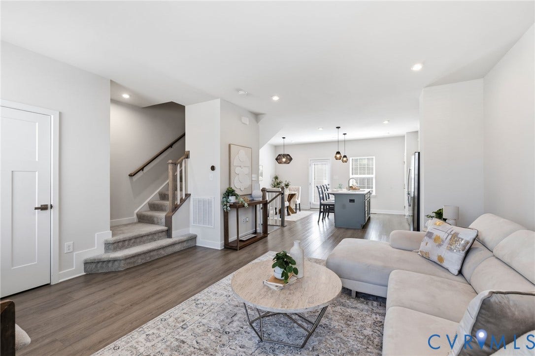 Open Concept Living area with LV wood finished flooring , recessed lighting perfect for entertaining