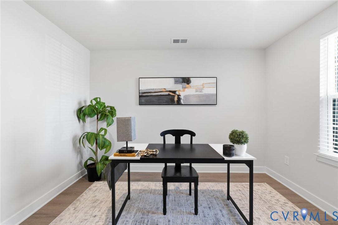 Wood-finish flooring office or bonus room on the first floor