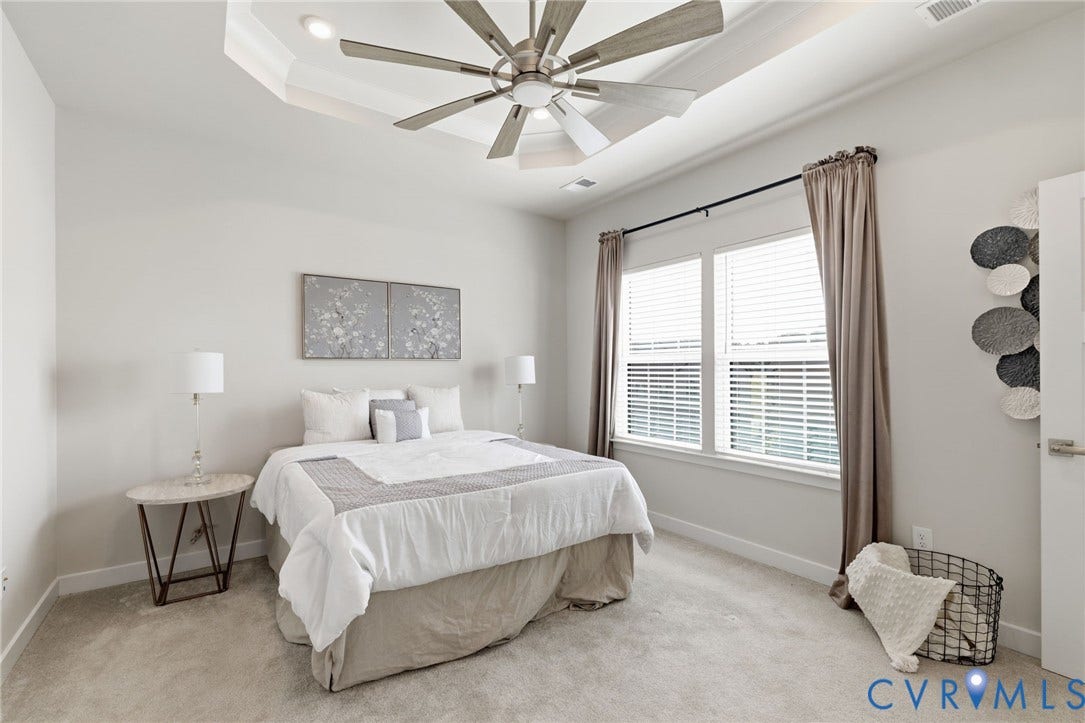 Tray ceiling with recessed lighting, ceiling fan, carpeting