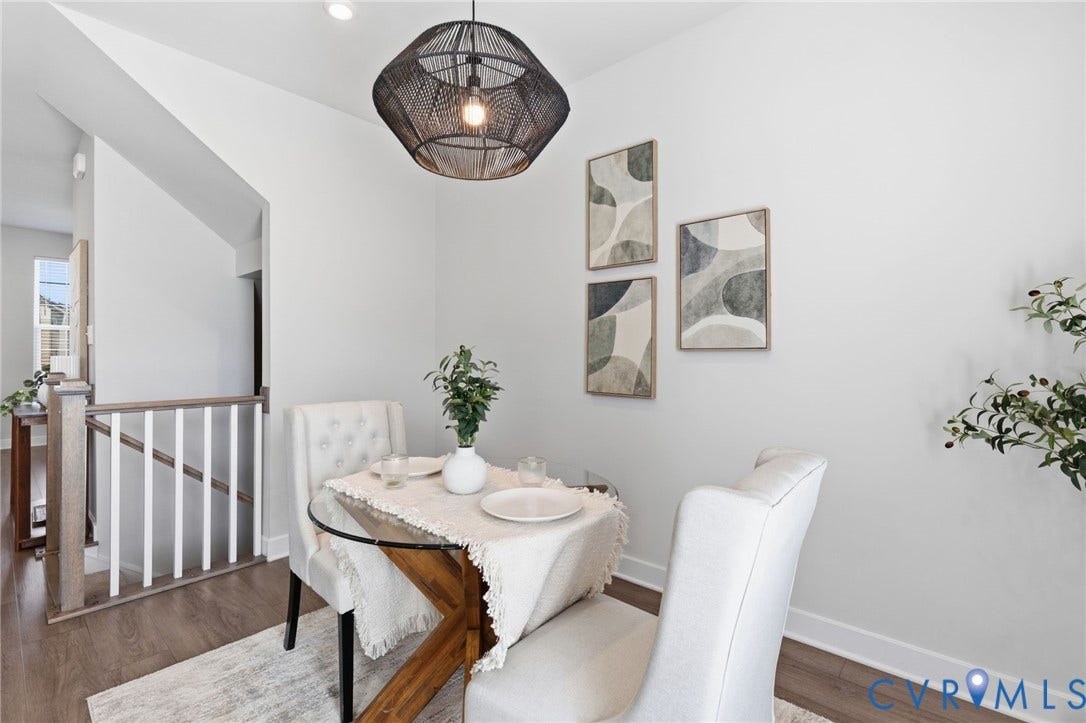 Dining area featuring a contemporary woven pendant light and wood-finish flooring