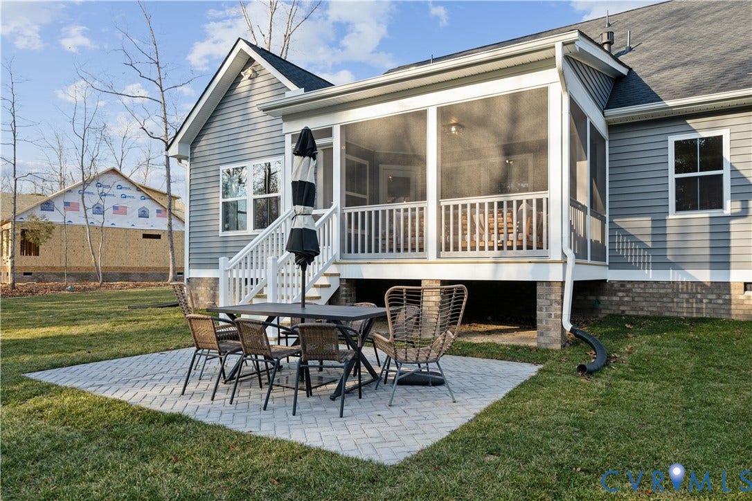 535 Wendenburg Terrace, #MODEL, Kennington, Aylett, VA 23009 Screened-in porch with white railings, a ground-level paver patio, and a well-maintained lawn