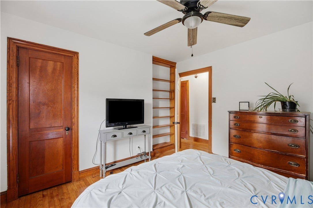 Wood-finish flooring throughout, complemented by wood-paneled doors and trim
