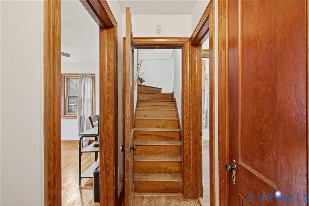 Wood-finish flooring, wood trim, and a wood staircase