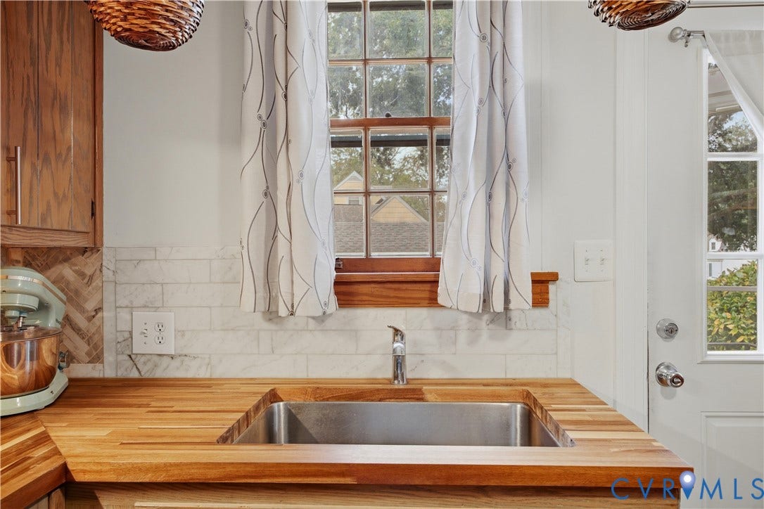 Wood countertops with an undermount sink and a stainless steel faucet