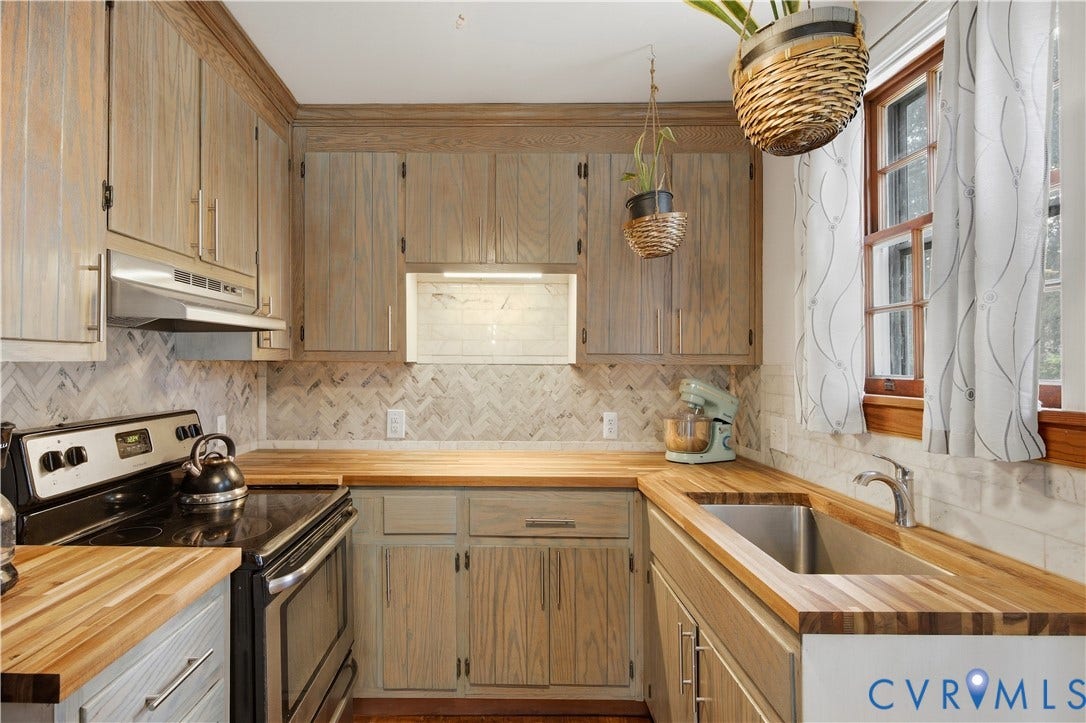 Wood-finish cabinetry and butcher block countertops