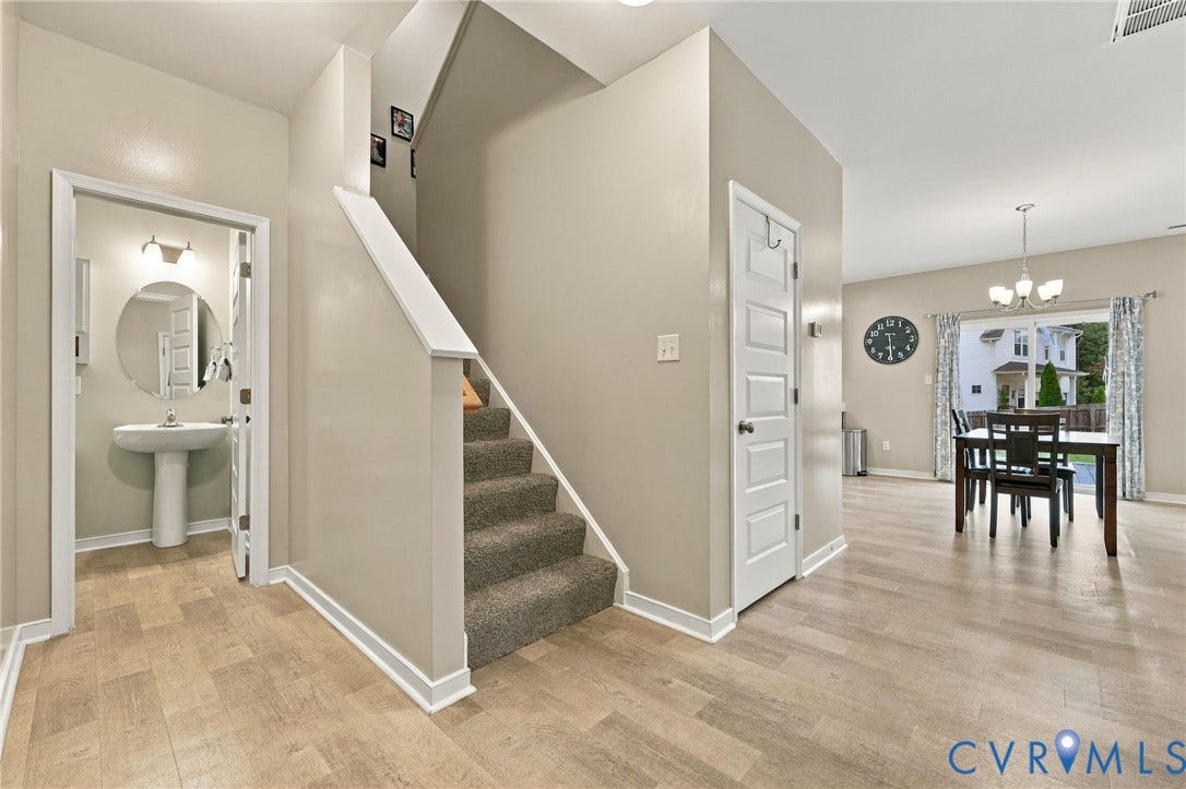 Open main-level layout with easy flow between the living spaces, kitchen, and dining area.