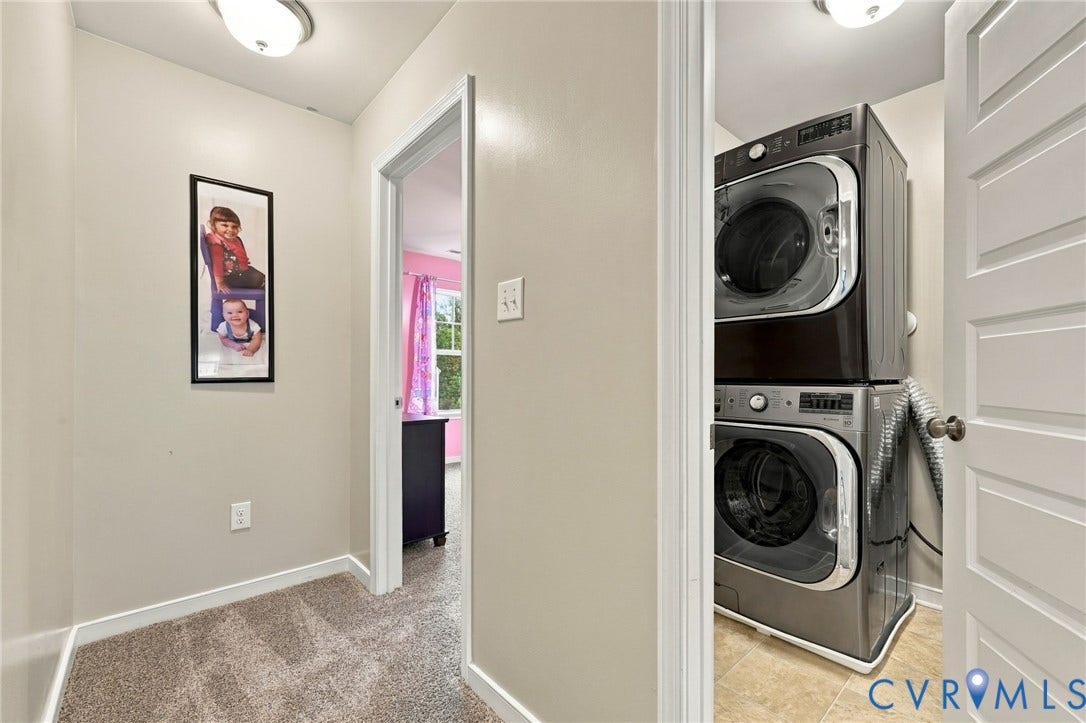 Convenient second-floor laundry is centrally located near the bedrooms.