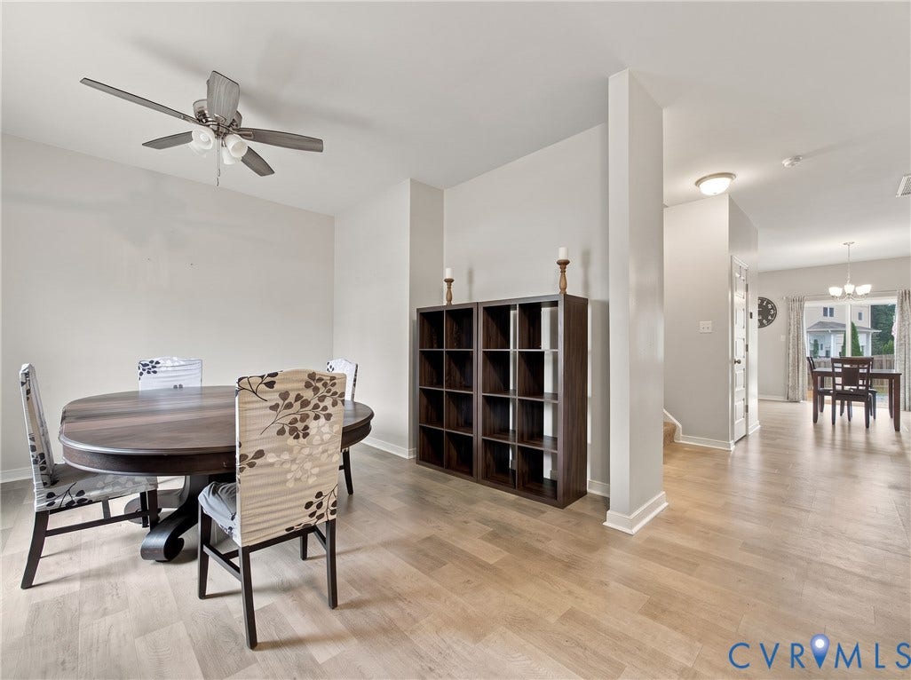 Enter into the spacious dining room with neutral finishes and an open layout that flows easily into the main living areas.