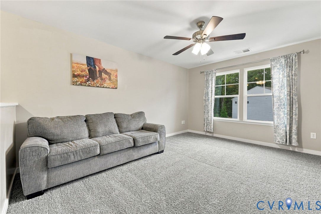 Spacious upstairs loft offers flexible living space perfect for a second family room, playroom, or media area.