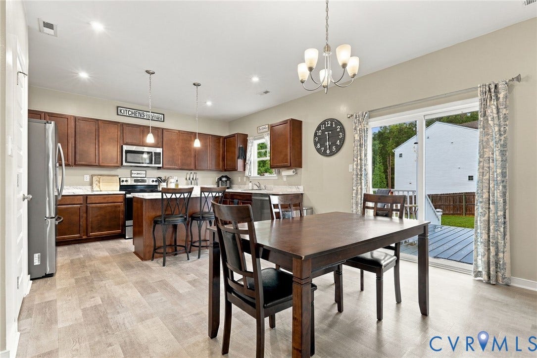 Spacious eat-in kitchen and sliding door to HUGE trex deck.