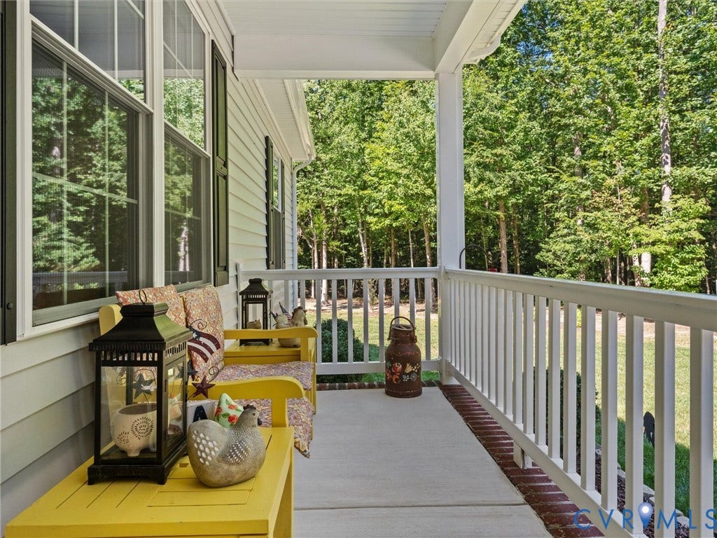 5927 Trenholm Village Drive, Trenholm Village, Powhatan, VA 23139 Covered front porch with white railings, a concrete surface, and white siding