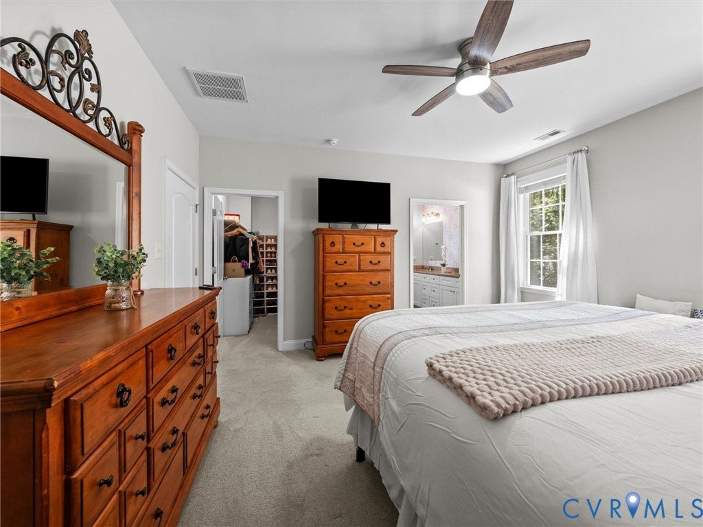 5927 Trenholm Village Drive, Trenholm Village, Powhatan, VA 23139 Carpeted flooring, ceiling fan with integrated lighting, window with white curtains, and a doorway to an adjacent room