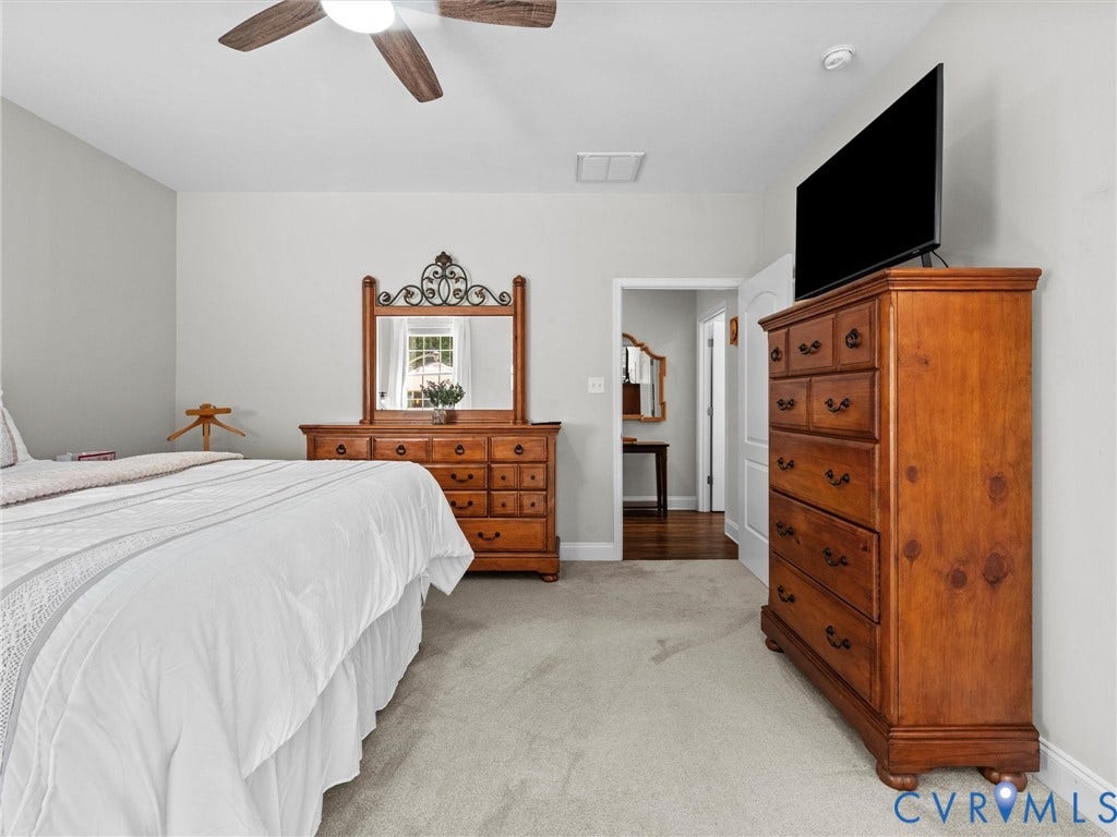 5927 Trenholm Village Drive, Trenholm Village, Powhatan, VA 23139 Carpeted flooring, vaulted ceiling, ceiling fan with integrated lighting, and a white paneled door