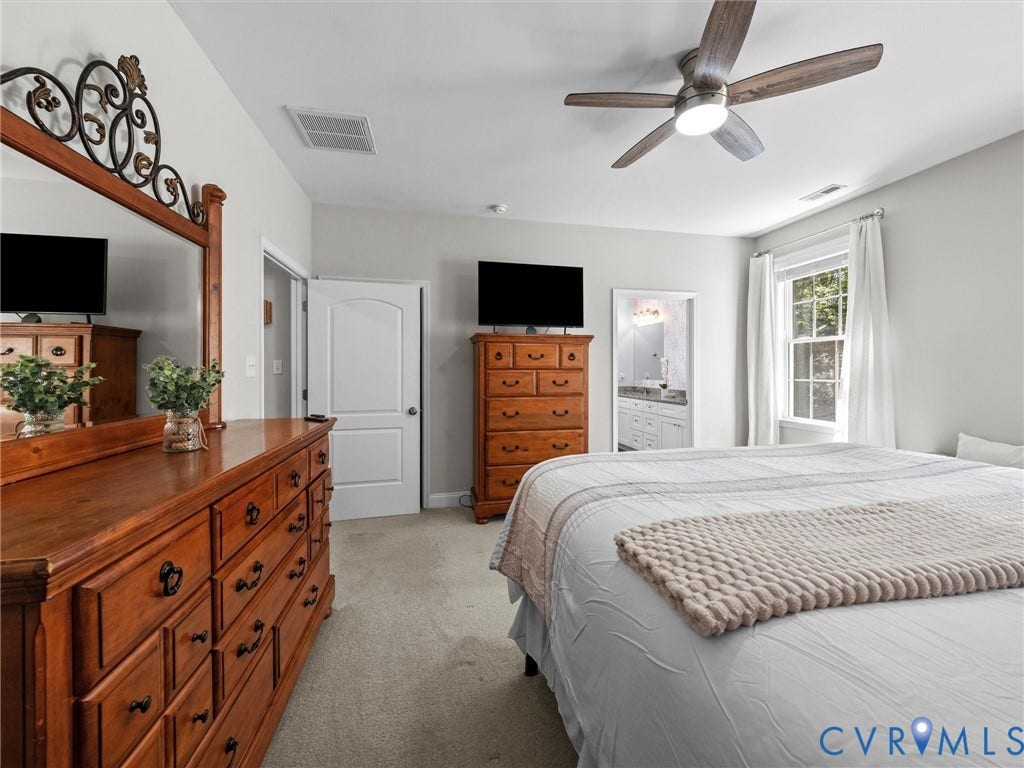 5927 Trenholm Village Drive, Trenholm Village, Powhatan, VA 23139 Recessed lighting, wood-finish ceiling fan, neutral wall tones, carpeted flooring, and a large window with natural light