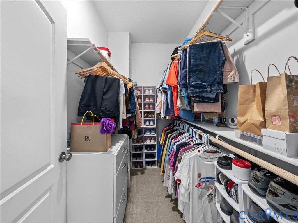 5927 Trenholm Village Drive, Trenholm Village, Powhatan, VA 23139 Walk-in closet featuring built-in shelving, hanging rods, and integrated drawer storage