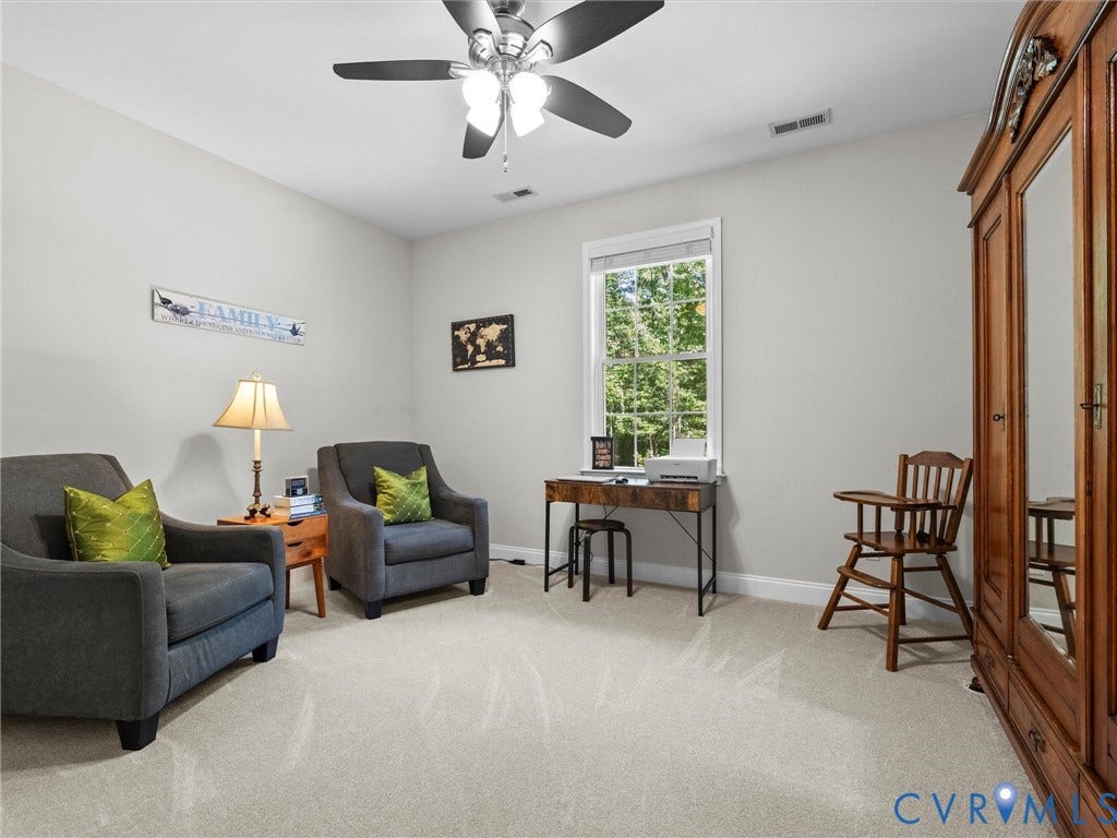 5927 Trenholm Village Drive, Trenholm Village, Powhatan, VA 23139 Ceiling fan with integrated lighting, window with exterior landscape, light-toned wall paint, neutral carpeting, and white trim