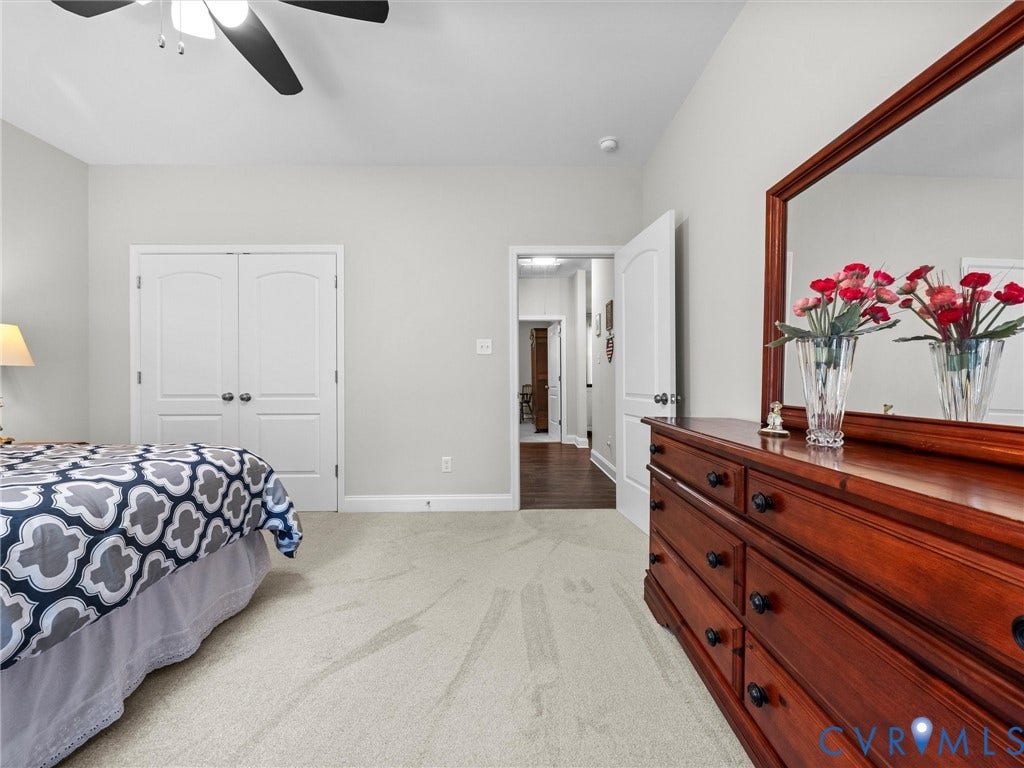 5927 Trenholm Village Drive, Trenholm Village, Powhatan, VA 23139 Plush carpeting, light gray wall color, white double bi-fold closet doors, and a ceiling fan with light fixture