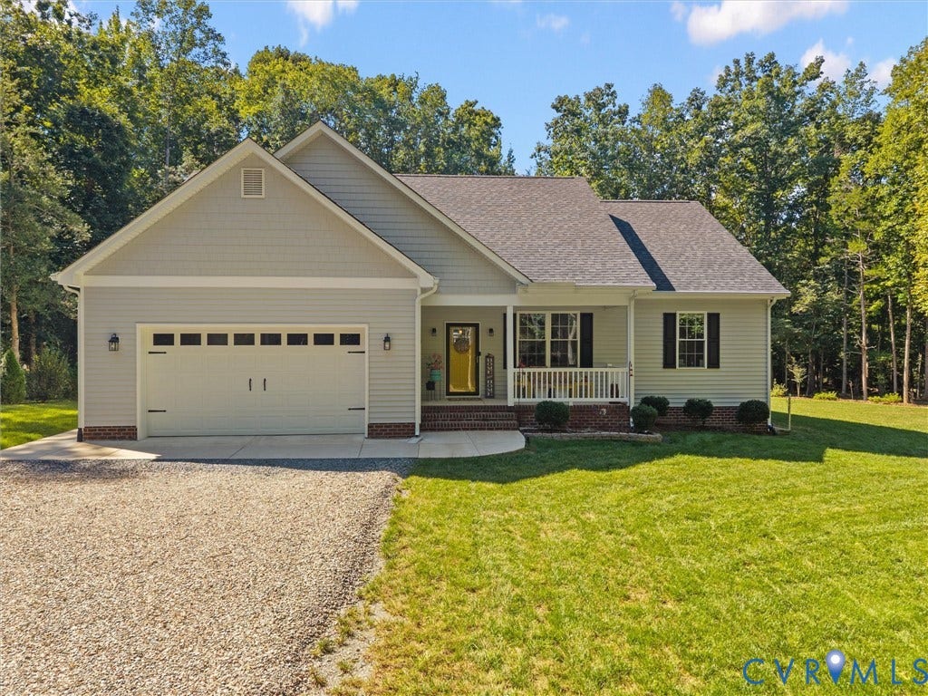 5927 Trenholm Village Drive, Trenholm Village, Powhatan, VA 23139 Ranch-style exterior with light gray siding, an attached two-car garage, and a covered front porch with white railings