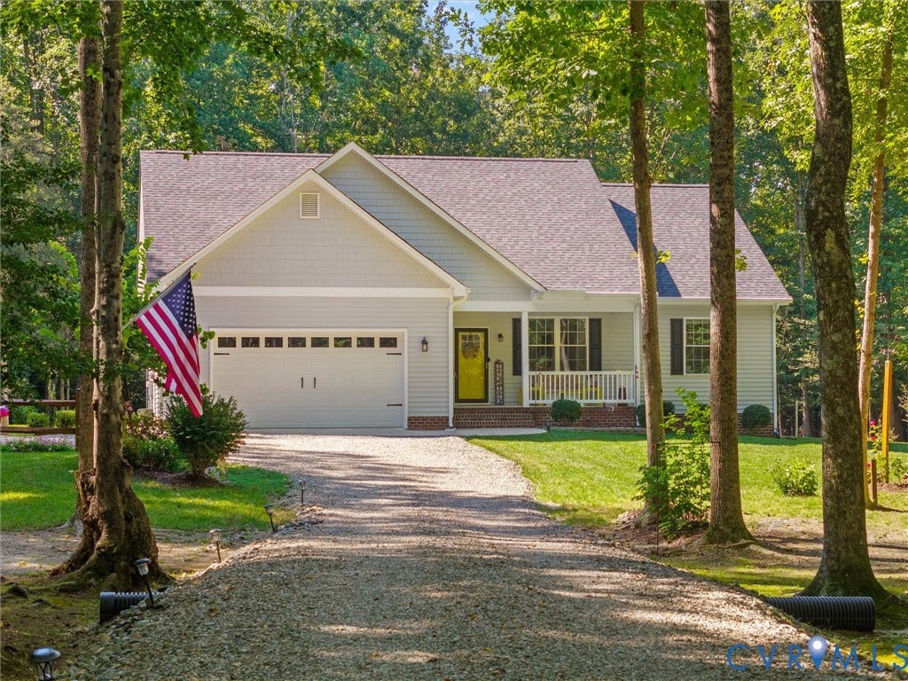 5927 Trenholm Village Drive, Trenholm Village, Powhatan, VA 23139 Light blue siding exterior with a covered front porch featuring white railings