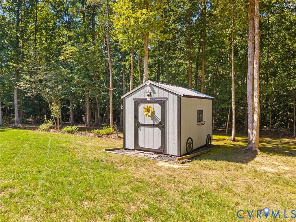 5927 Trenholm Village Drive, Trenholm Village, Powhatan, VA 23139 Freestanding storage shed with a metal roof and double barn doors
