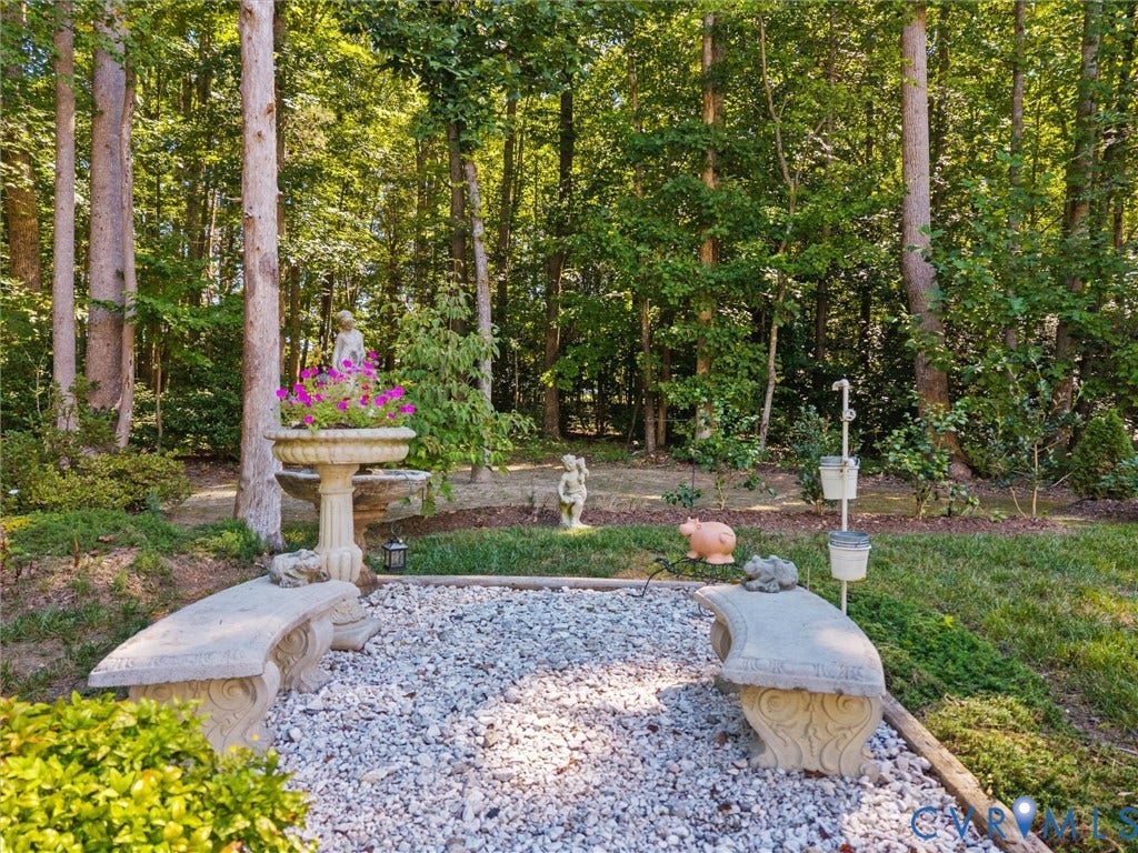 5927 Trenholm Village Drive, Trenholm Village, Powhatan, VA 23139 Gravel patio area with two stone benches