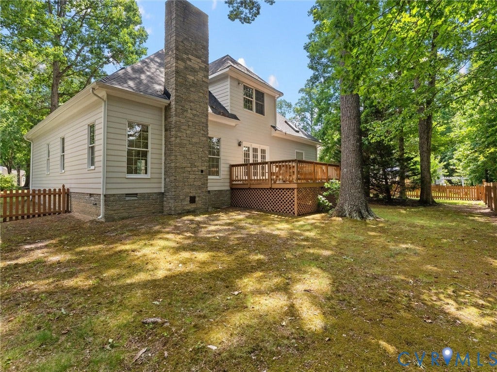 3700 Bremerton Drive, Wellesley, Henrico, VA 23233 Stone chimney accent, wood-finish deck, picket fencing, and mature trees