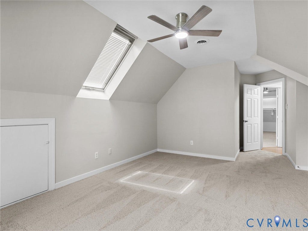 3700 Bremerton Drive, Wellesley, Henrico, VA 23233 Angled ceiling room with a skylight, ceiling fan, and light gray wall paint