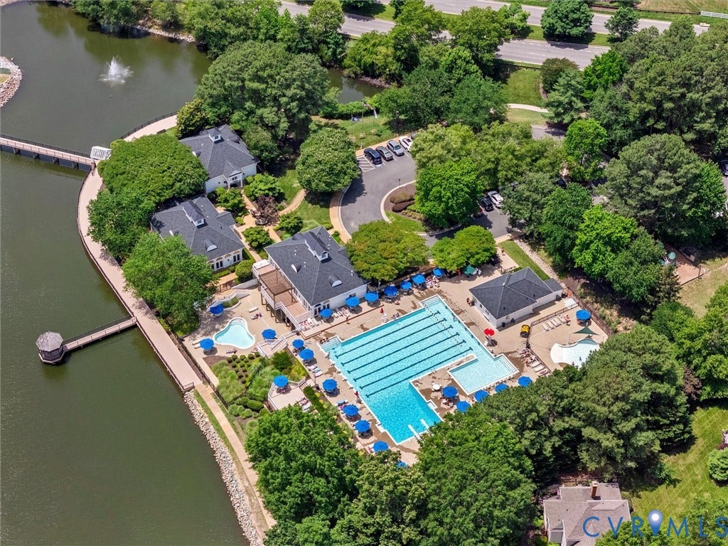 3700 Bremerton Drive, Wellesley, Henrico, VA 23233 Community amenities featuring a multi-lane swimming pool, resort-style pool with integrated water feature, and a paved sundeck with lounge chairs