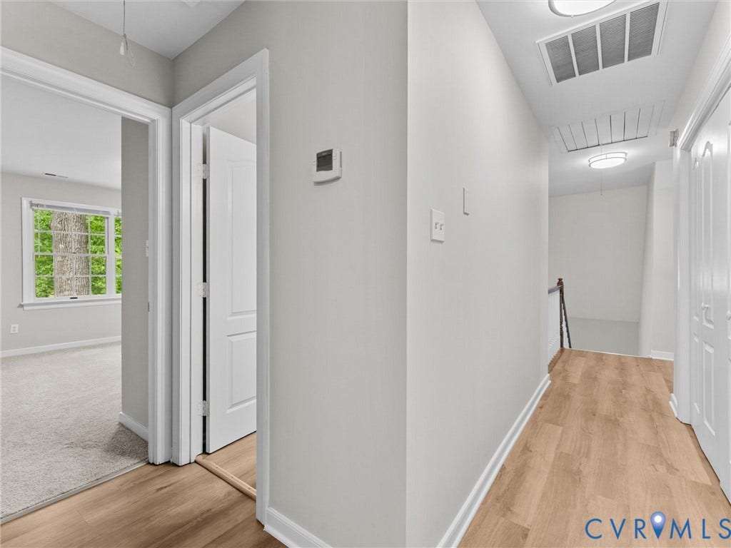 3700 Bremerton Drive, Wellesley, Henrico, VA 23233 Hallway with wood-finish flooring, white trim, and flush-mount lighting
