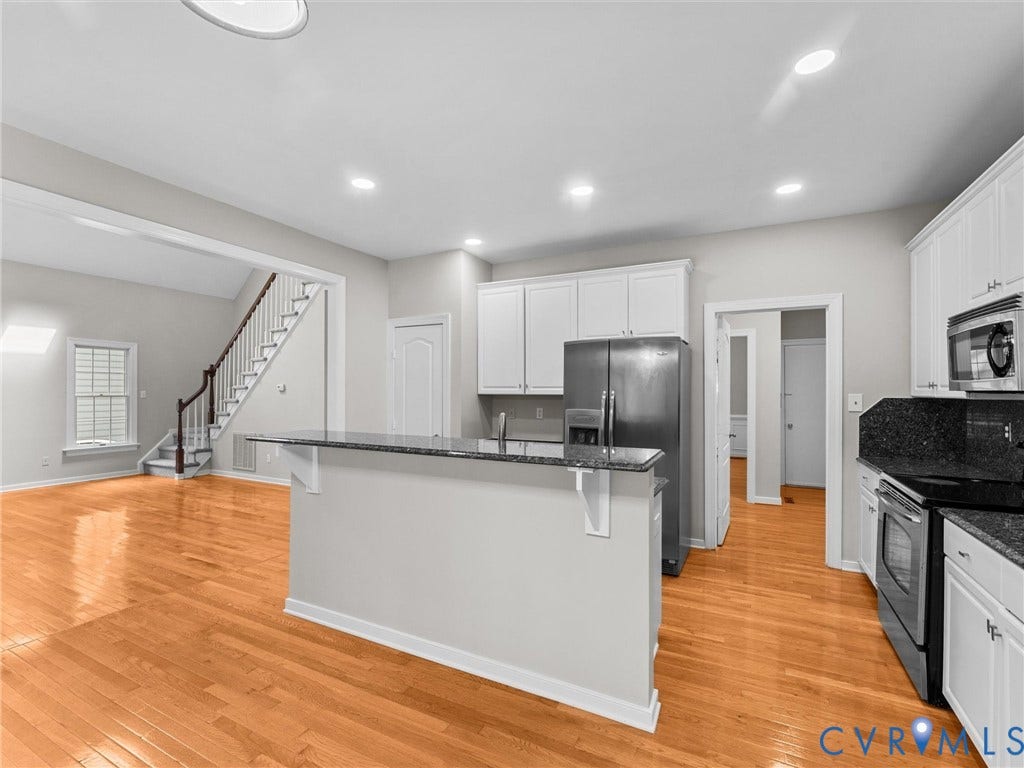 3700 Bremerton Drive, Wellesley, Henrico, VA 23233 Kitchen featuring a breakfast bar with stone countertops and white cabinetry