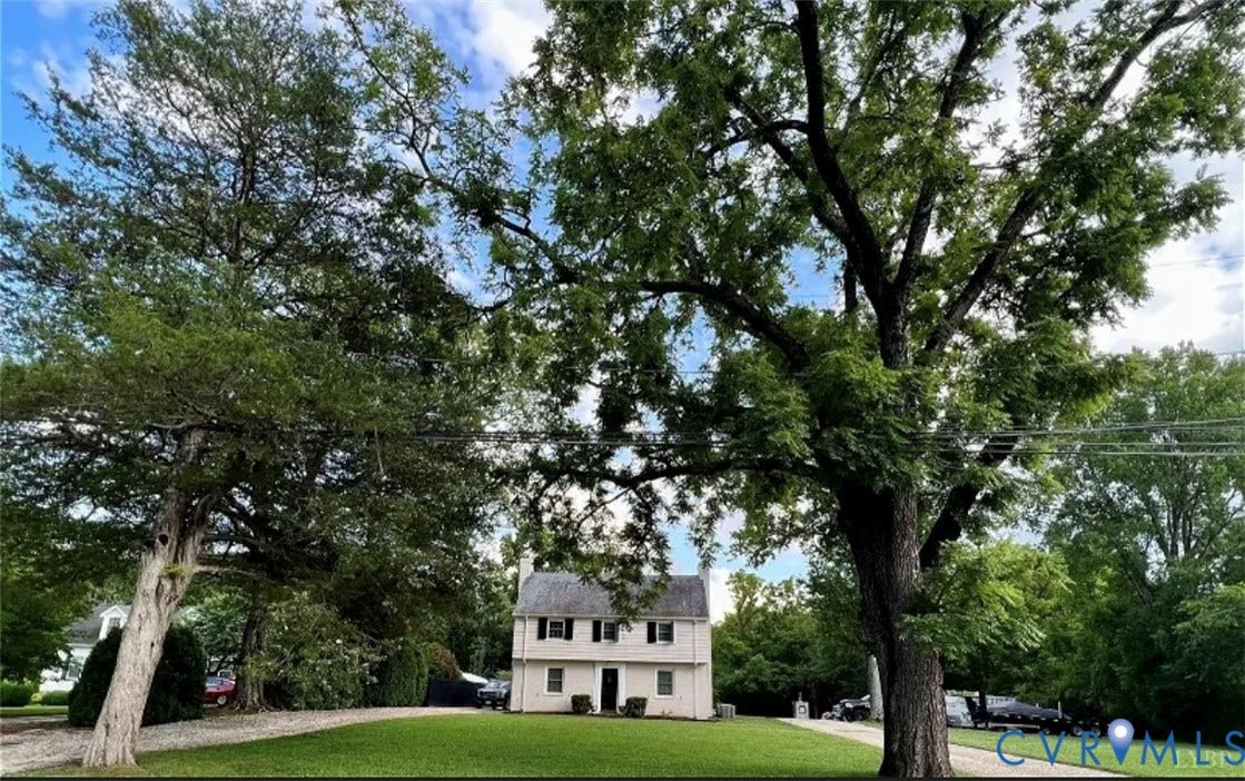 13232 W James Anderson Highway, Courthouse Area, Buckingham, VA 23921 Two-story residence with a light-colored exterior, dark shutters, and a gabled roof