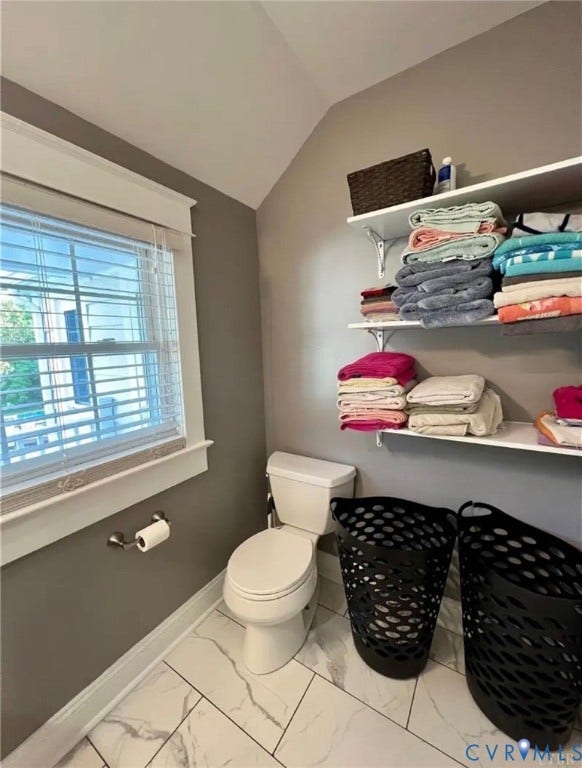 13232 W James Anderson Highway, Courthouse Area, Buckingham, VA 23921 White-tiled flooring, white toilet, and window with white blinds