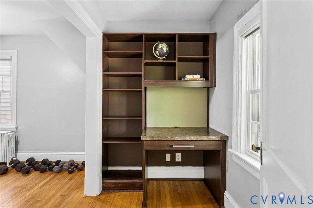 5113 King William Road, Westover Hills, Richmond, VA 23225 Built-in desk with a stone-finish countertop and integrated shelving, hardwood flooring, and a window with white trim