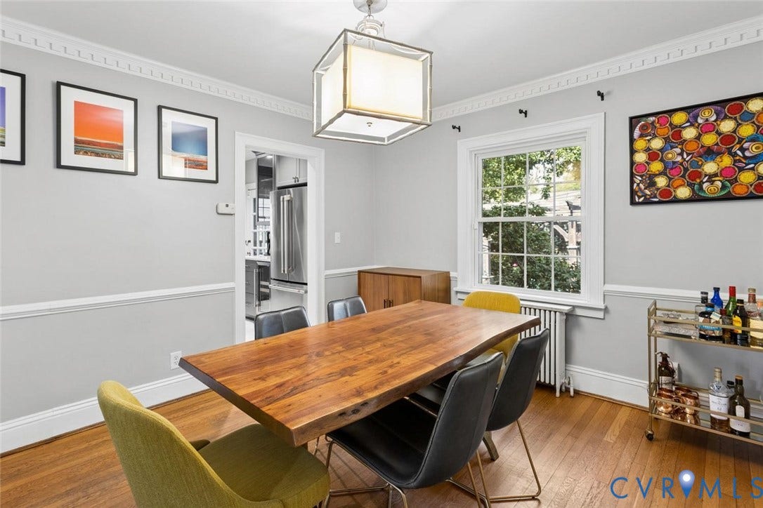 5113 King William Road, Westover Hills, Richmond, VA 23225 Hardwood flooring, crown molding, chair rail molding, a large framed window, and a rectangular ceiling light fixture