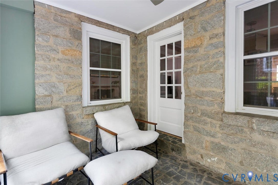 5113 King William Road, Westover Hills, Richmond, VA 23225 Stone-clad exterior wall, single-pane window with white trim, white French door, and stone paver flooring