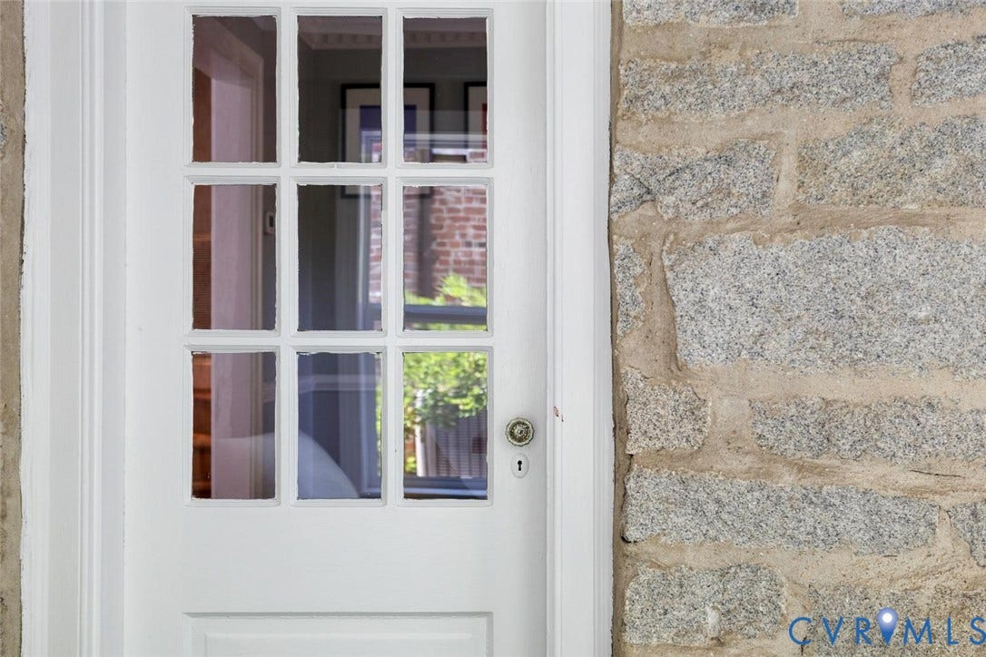 5113 King William Road, Westover Hills, Richmond, VA 23225 White panel door with multi-pane window, brass doorknob, and stone exterior wall
