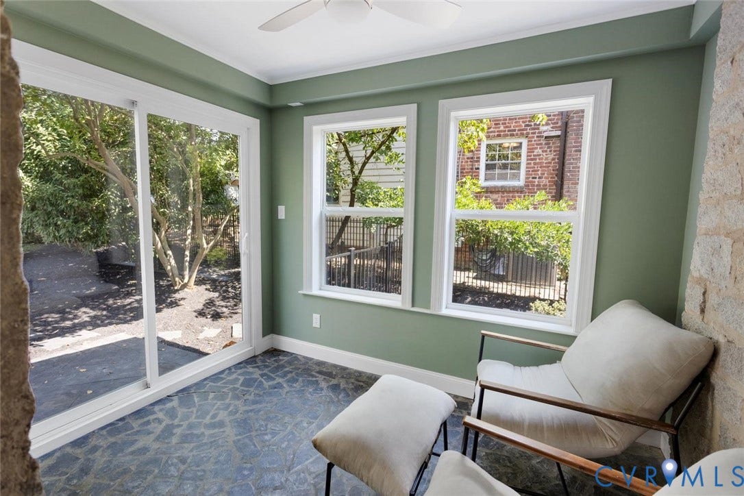 5113 King William Road, Westover Hills, Richmond, VA 23225 Sunroom featuring a ceiling fan, sliding glass door, multiple windows, and irregular stone flooring