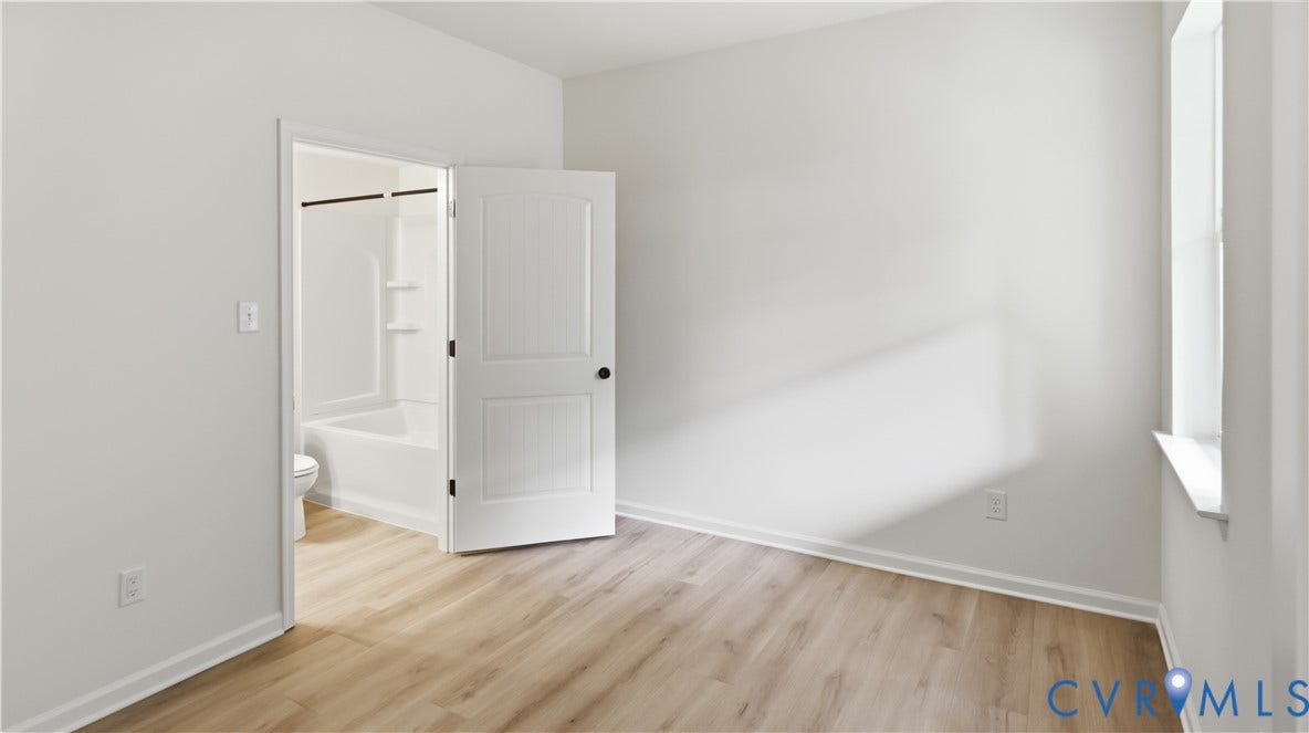 First Floor Guest Suite - This photo shows a similar floorplan and quality level to Eastwood Homes. Actual design selections and layout may vary.