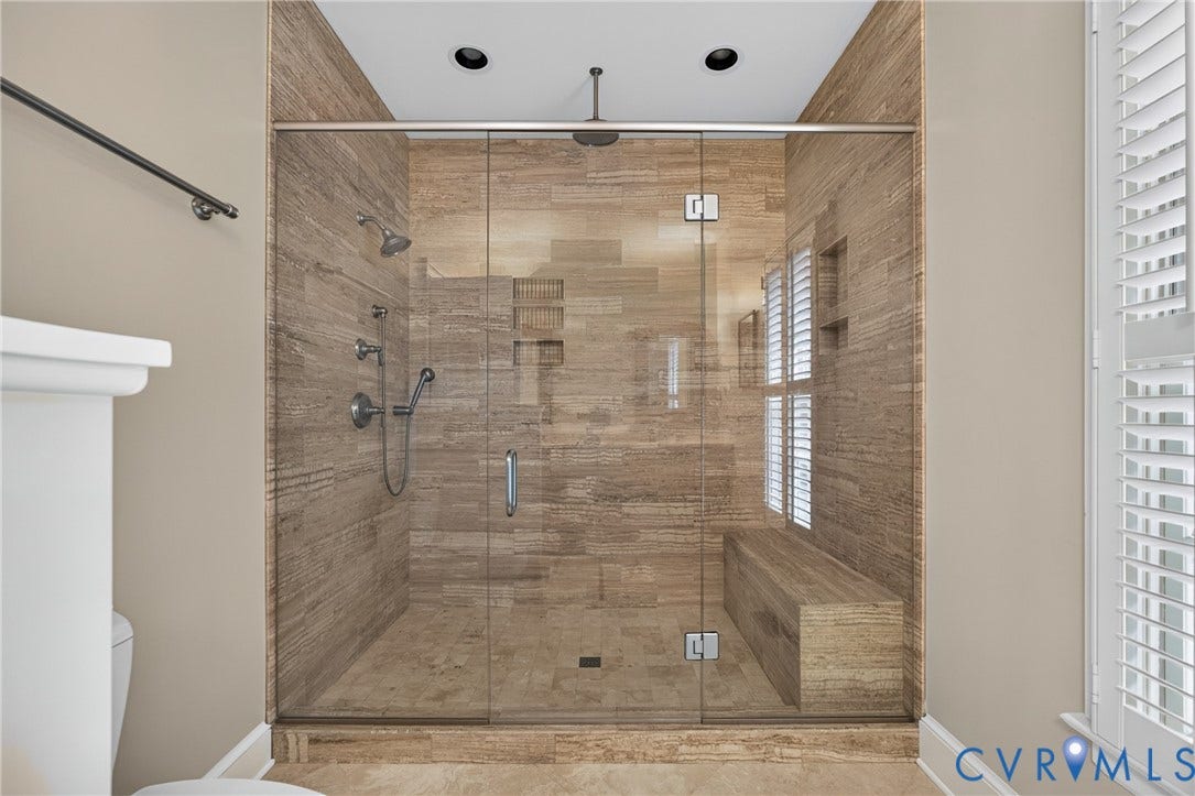 1108 Shallow Well Road, Manakin Sabot, VA 23103 Glass-enclosed shower with tile surround, built-in bench, and recessed shelving
