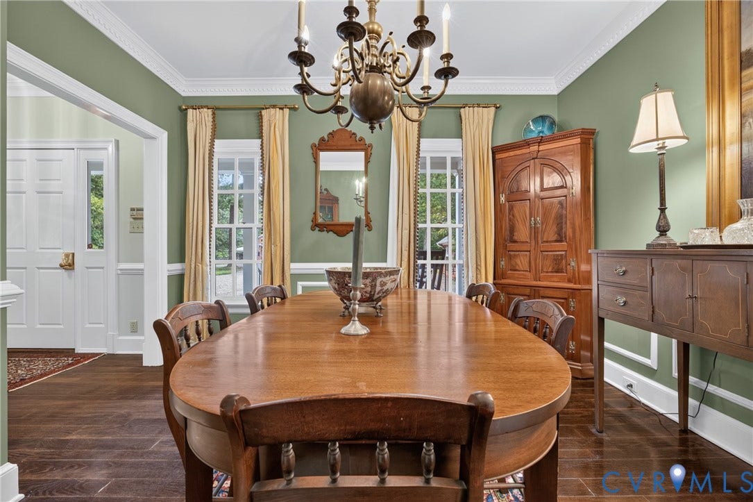 1108 Shallow Well Road, Manakin Sabot, VA 23103 Hardwood-finish flooring, decorative crown molding, wainscoting, and a brass-tone chandelier