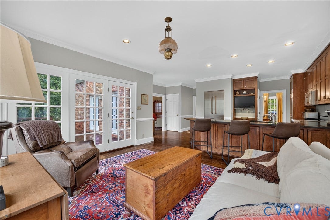 1108 Shallow Well Road, Manakin Sabot, VA 23103 Wood-finish flooring throughout, French doors with grid-patterned panes, recessed lighting, and a kitchen island with built-in cabinetry